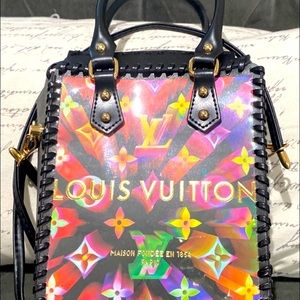 Louis Vuitton special edition PVC and leather trim crossbody bag.